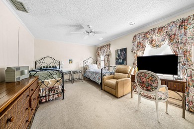 Nestled on a quiet cul-de-sac in the desirable Boca Woods on Boca Woods Country Club in Florida - for sale on GolfHomes.com, golf home, golf lot