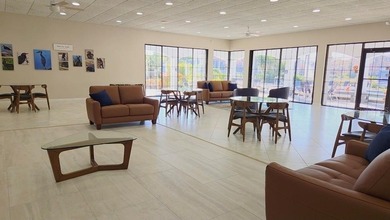 Discover this light-filled and spacious end-unit condo in the on Feather Sound Country Club in Florida - for sale on GolfHomes.com, golf home, golf lot