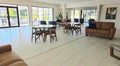 Discover this light-filled and spacious end-unit condo in the on Feather Sound Country Club in Florida - for sale on GolfHomes.com, golf home, golf lot