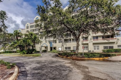 Discover this light-filled and spacious end-unit condo in the on Feather Sound Country Club in Florida - for sale on GolfHomes.com, golf home, golf lot