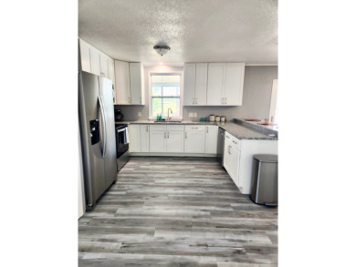 If you've been searching for a beautifully updated home in sunny on Lake Fairways Country Club in Florida - for sale on GolfHomes.com, golf home, golf lot