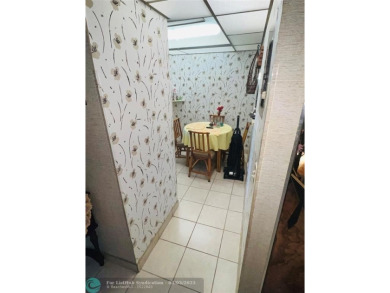 This charming two-bedroom, two-bath condo offers a cozy retreat on Sunrise Lakes Phase III in Florida - for sale on GolfHomes.com, golf home, golf lot