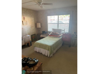 This charming two-bedroom, two-bath condo offers a cozy retreat on Sunrise Lakes Phase III in Florida - for sale on GolfHomes.com, golf home, golf lot