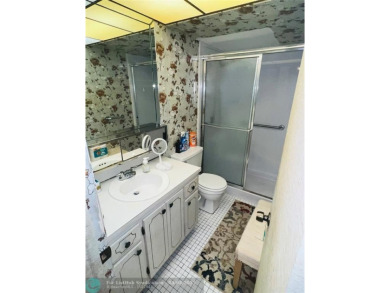 This charming two-bedroom, two-bath condo offers a cozy retreat on Sunrise Lakes Phase III in Florida - for sale on GolfHomes.com, golf home, golf lot