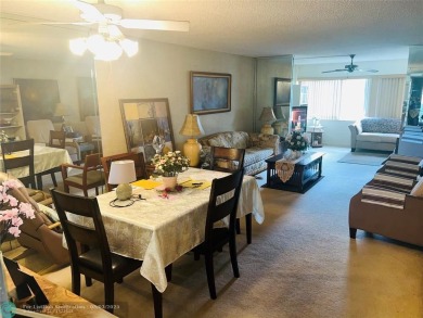 This charming two-bedroom, two-bath condo offers a cozy retreat on Sunrise Lakes Phase III in Florida - for sale on GolfHomes.com, golf home, golf lot