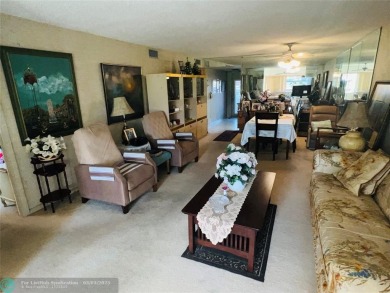This charming two-bedroom, two-bath condo offers a cozy retreat on Sunrise Lakes Phase III in Florida - for sale on GolfHomes.com, golf home, golf lot