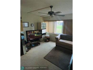 This charming two-bedroom, two-bath condo offers a cozy retreat on Sunrise Lakes Phase III in Florida - for sale on GolfHomes.com, golf home, golf lot