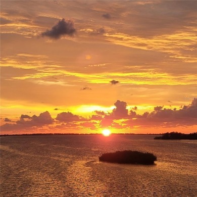 WATERFRONT LIFE AT ITS BEST! Spectacular sunsets, relaxing on The Dunedin Country Club in Florida - for sale on GolfHomes.com, golf home, golf lot