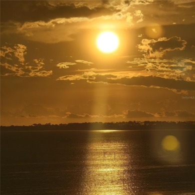 WATERFRONT LIFE AT ITS BEST! Spectacular sunsets, relaxing on The Dunedin Country Club in Florida - for sale on GolfHomes.com, golf home, golf lot