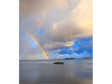 WATERFRONT LIFE AT ITS BEST! Spectacular sunsets, relaxing on The Dunedin Country Club in Florida - for sale on GolfHomes.com, golf home, golf lot