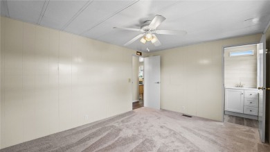 Worried about shoveling snow this winter? Florida says hello on Barefoot Bay Golf Course in Florida - for sale on GolfHomes.com, golf home, golf lot
