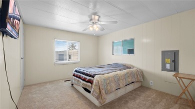 Worried about shoveling snow this winter? Florida says hello on Barefoot Bay Golf Course in Florida - for sale on GolfHomes.com, golf home, golf lot