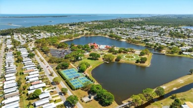 Worried about shoveling snow this winter? Florida says hello on Barefoot Bay Golf Course in Florida - for sale on GolfHomes.com, golf home, golf lot