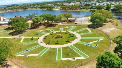 Worried about shoveling snow this winter? Florida says hello on Barefoot Bay Golf Course in Florida - for sale on GolfHomes.com, golf home, golf lot
