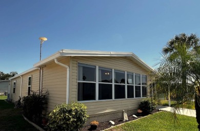 Welcome to your dream oasis! This stunning 2-bedroom, 2-bathroom on Lake Henry Golf Club in Florida - for sale on GolfHomes.com, golf home, golf lot