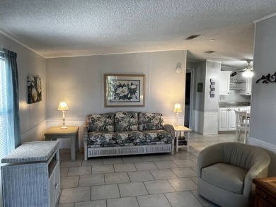 Welcome to your dream oasis! This stunning 2-bedroom, 2-bathroom on Lake Henry Golf Club in Florida - for sale on GolfHomes.com, golf home, golf lot