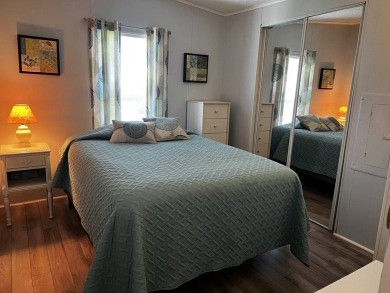 Welcome to your dream oasis! This stunning 2-bedroom, 2-bathroom on Lake Henry Golf Club in Florida - for sale on GolfHomes.com, golf home, golf lot