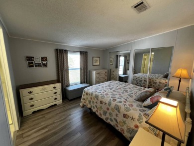 Welcome to your dream oasis! This stunning 2-bedroom, 2-bathroom on Lake Henry Golf Club in Florida - for sale on GolfHomes.com, golf home, golf lot