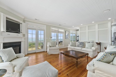 This exceptional oceanfront home in Roosevelt Beach showcases on The Country Club of the Crystal Coast in North Carolina - for sale on GolfHomes.com, golf home, golf lot