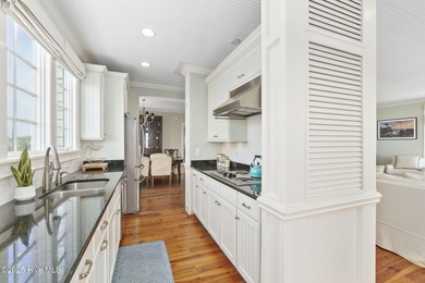 This exceptional oceanfront home in Roosevelt Beach showcases on The Country Club of the Crystal Coast in North Carolina - for sale on GolfHomes.com, golf home, golf lot