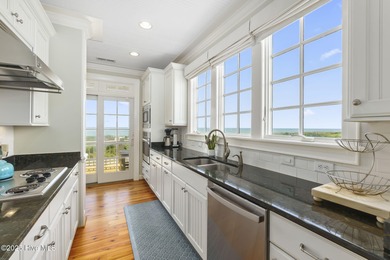 This exceptional oceanfront home in Roosevelt Beach showcases on The Country Club of the Crystal Coast in North Carolina - for sale on GolfHomes.com, golf home, golf lot