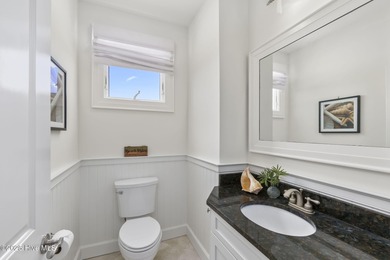 This exceptional oceanfront home in Roosevelt Beach showcases on The Country Club of the Crystal Coast in North Carolina - for sale on GolfHomes.com, golf home, golf lot