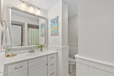 This exceptional oceanfront home in Roosevelt Beach showcases on The Country Club of the Crystal Coast in North Carolina - for sale on GolfHomes.com, golf home, golf lot