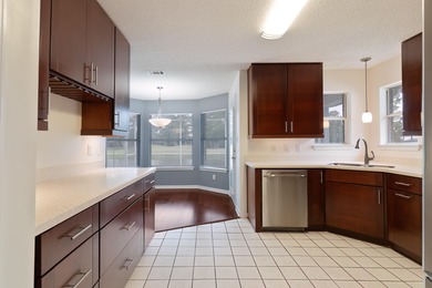 Experience the perfect blend of comfort, charm, and lifestyle in on Shalimar Pointe Golf and Country Club in Florida - for sale on GolfHomes.com, golf home, golf lot