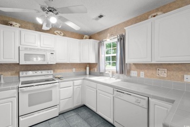 Located in the heart of Pawleys Island, this move-in ready on The Founders Club At Pawleys Island in South Carolina - for sale on GolfHomes.com, golf home, golf lot