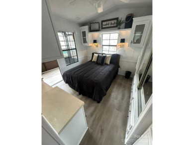 Welcome to your lake getaway at Twin Harbor, whether you are on The Tillery Tradition Country Club in North Carolina - for sale on GolfHomes.com, golf home, golf lot