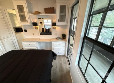 Welcome to your lake getaway at Twin Harbor, whether you are on The Tillery Tradition Country Club in North Carolina - for sale on GolfHomes.com, golf home, golf lot