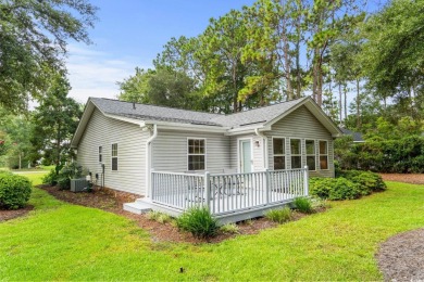 Located in the heart of Pawleys Island, this move-in ready on The Founders Club At Pawleys Island in South Carolina - for sale on GolfHomes.com, golf home, golf lot