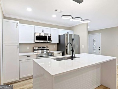 Exceptionally Renovated Four-Sided Brick Ranch On A Quiet Street on East Lake Golf Club in Georgia - for sale on GolfHomes.com, golf home, golf lot