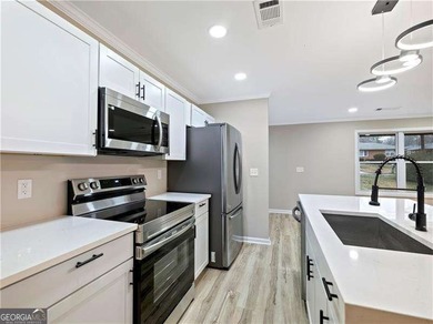 Exceptionally Renovated Four-Sided Brick Ranch On A Quiet Street on East Lake Golf Club in Georgia - for sale on GolfHomes.com, golf home, golf lot