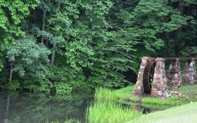 Gentle lying .77 acre building lot with good mountain views with on Mountain Harbour Golf Club in North Carolina - for sale on GolfHomes.com, golf home, golf lot
