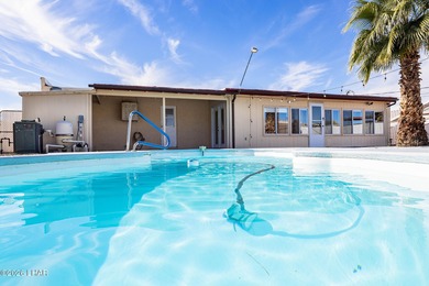 Located in the heart of Lake Havasu City, this 3-bedroom, 2-bath on London Bridge Golf Course in Arizona - for sale on GolfHomes.com, golf home, golf lot