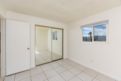 Located in the heart of Lake Havasu City, this 3-bedroom, 2-bath on London Bridge Golf Course in Arizona - for sale on GolfHomes.com, golf home, golf lot