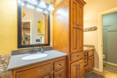 Welcome to your dream home! Nestled on an expansive corner lot on Elk City Golf and Country Club in Oklahoma - for sale on GolfHomes.com, golf home, golf lot