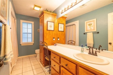 Welcome to your dream home! Nestled on an expansive corner lot on Elk City Golf and Country Club in Oklahoma - for sale on GolfHomes.com, golf home, golf lot