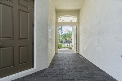 THIS HOME WILL BE GETTING A NEW ROOF PRIOR TO CLOSING! This on Tampa Bay Golf and Country Club in Florida - for sale on GolfHomes.com, golf home, golf lot