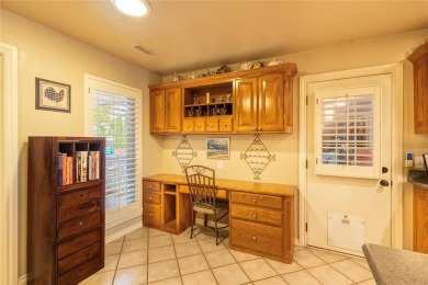 Welcome to your dream home! Nestled on an expansive corner lot on Elk City Golf and Country Club in Oklahoma - for sale on GolfHomes.com, golf home, golf lot