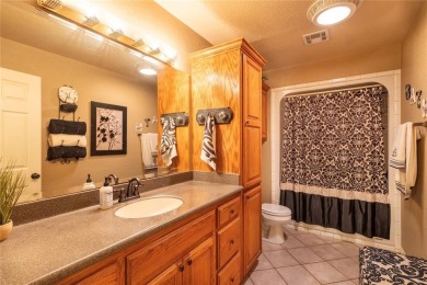Welcome to your dream home! Nestled on an expansive corner lot on Elk City Golf and Country Club in Oklahoma - for sale on GolfHomes.com, golf home, golf lot