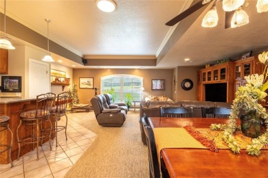 Welcome to your dream home! Nestled on an expansive corner lot on Elk City Golf and Country Club in Oklahoma - for sale on GolfHomes.com, golf home, golf lot