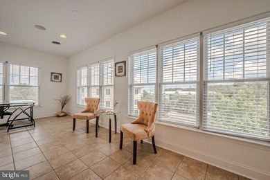 Resort-style living at its finest in this quiet, top-floor end on The Peninsula Golf and Country Club in Delaware - for sale on GolfHomes.com, golf home, golf lot