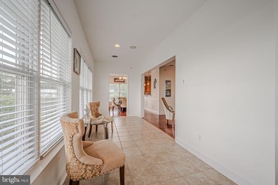 Resort-style living at its finest in this quiet, top-floor end on The Peninsula Golf and Country Club in Delaware - for sale on GolfHomes.com, golf home, golf lot