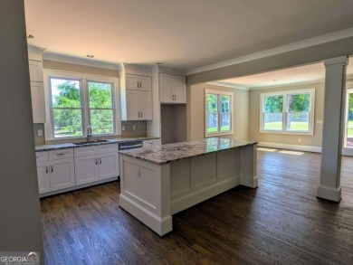 A golfer's paradise! This 4-bedroom, 3-bathroom home with 9' on Indian Creek Golf Club in Georgia - for sale on GolfHomes.com, golf home, golf lot