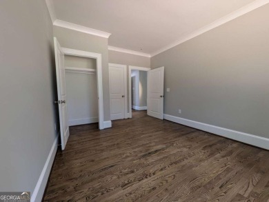 A golfer's paradise! This 4-bedroom, 3-bathroom home with 9' on Indian Creek Golf Club in Georgia - for sale on GolfHomes.com, golf home, golf lot
