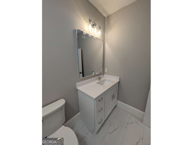 A golfer's paradise! This 4-bedroom, 3-bathroom home with 9' on Indian Creek Golf Club in Georgia - for sale on GolfHomes.com, golf home, golf lot