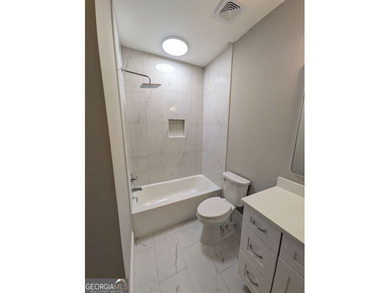 A golfer's paradise! This 4-bedroom, 3-bathroom home with 9' on Indian Creek Golf Club in Georgia - for sale on GolfHomes.com, golf home, golf lot