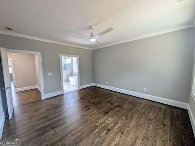 A golfer's paradise! This 4-bedroom, 3-bathroom home with 9' on Indian Creek Golf Club in Georgia - for sale on GolfHomes.com, golf home, golf lot